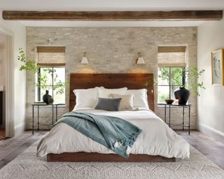 bedroom with exposed brick wall from Fixer Upper: Welcome Home