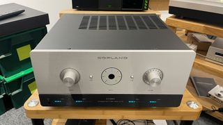 Copland CTA407 stereo amplifier on wooden hi-fi rack front/top angle