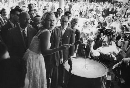 1960: Attending a ribbon-cutting ceremony