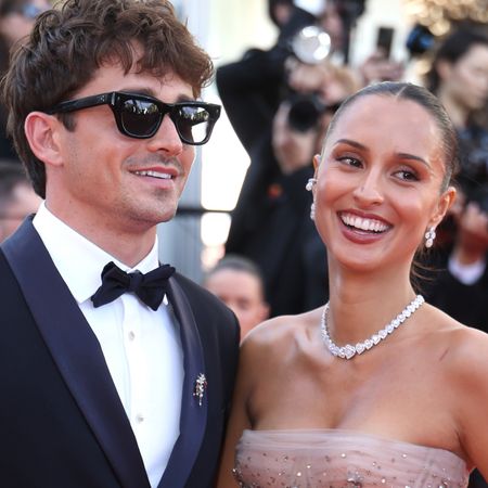 Charles and Alexandra Leclerc pose together at the 2026 Cannes Film Festival in red carpet looks
