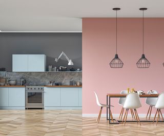 A kitchen with a pink wall and blue cabinets