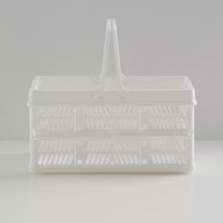 White plastic shower caddy basket