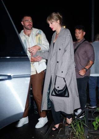 Taylor Swift carrying an Aupen bag with Travis Kelce