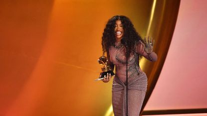 SZA on stage at the 66th Grammy Awards in 2024 after her win