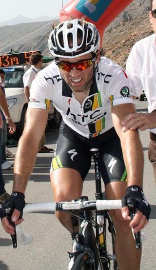 Michael Albasini (HTC-Highroad) gets a push after crossing the line.