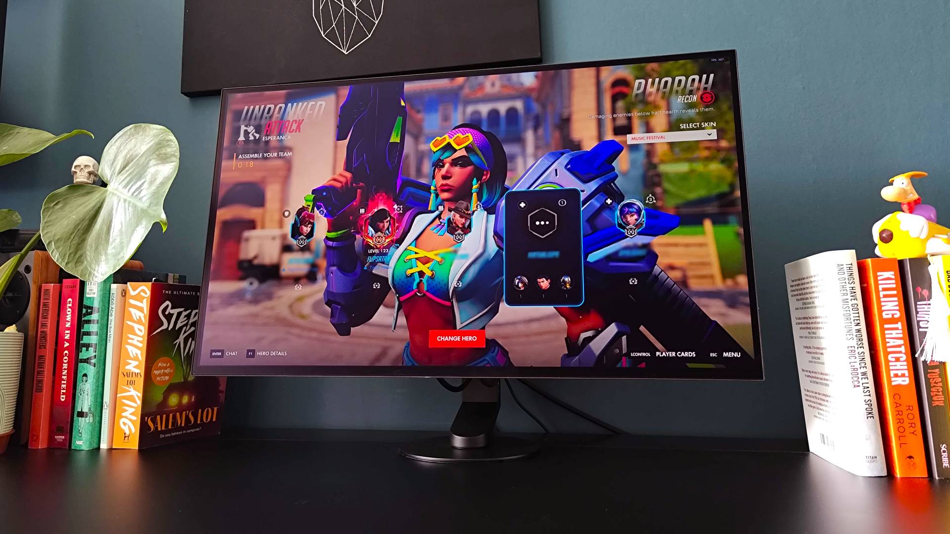 Sony Inzone M10S II monitor on black desk with Overwatch running on screen and Pharah waiting for match to start.