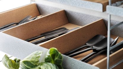 Cork shelf organizers used to lay wine bottles down and separate cutlery