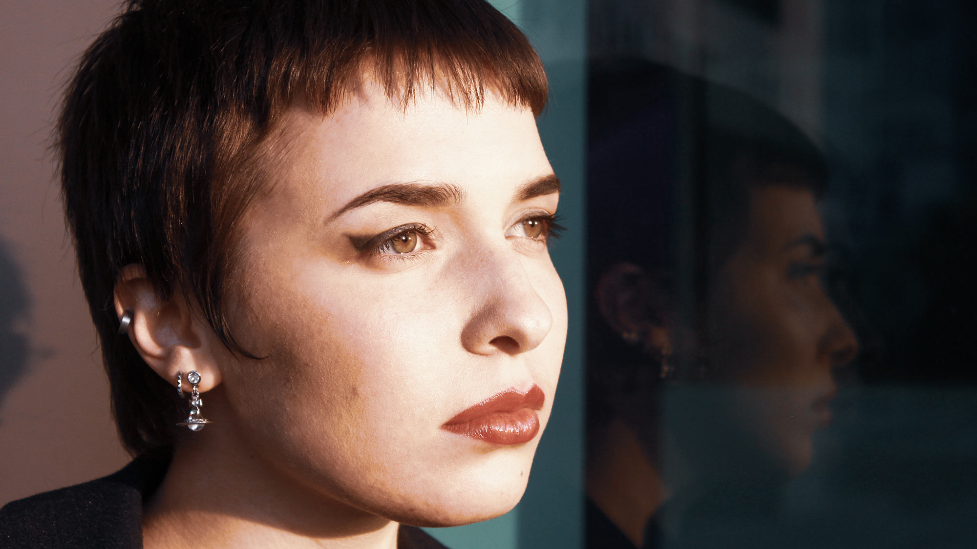 Close-Up Portrait Of Woman Looking Away