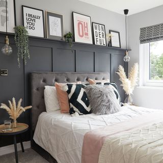 bedroom with black painted wall panelling