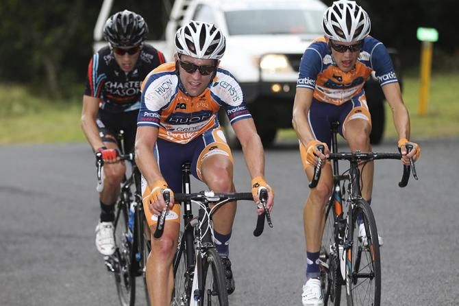 Earle, Ben Dyball (Huon Salmon-Genesys) and Matt Clark on the final climb up Bunya