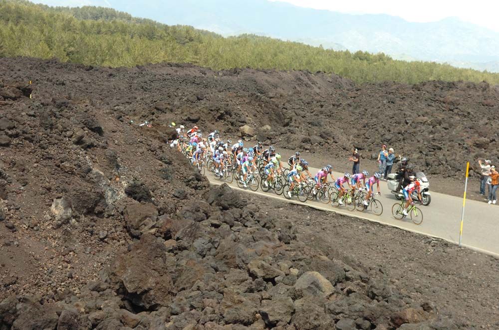 Riders emerge from Mount Etna's volcanic rock at the 2011 Giro