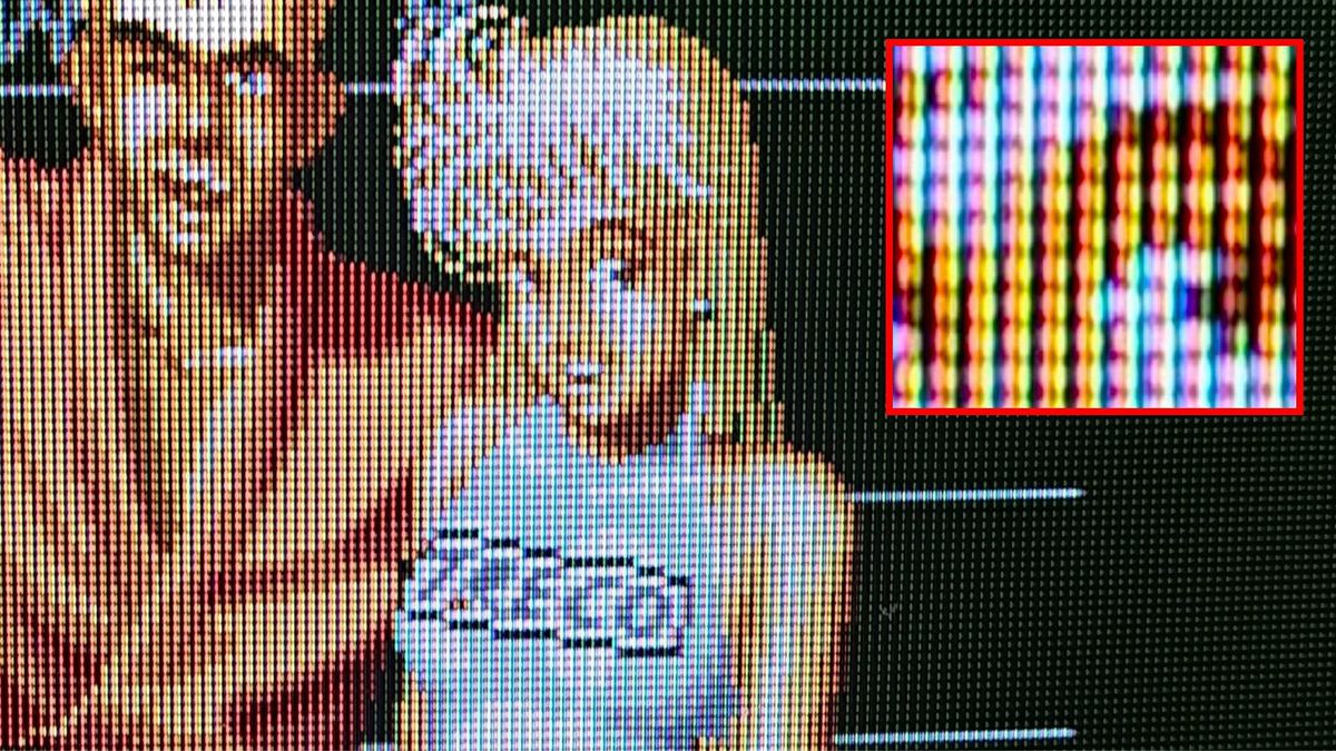 Close up of Sony Trinitron PVM with Street Smart pixel art of ring girl on screen and red square on right with zoomed-in shot of Aperture Grille pattern.