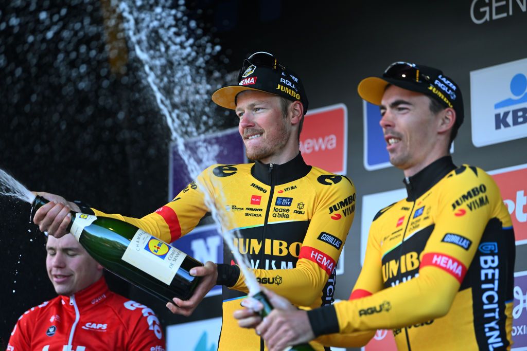 First and third at Omloop Het Nieuwsblad, Jumbo-Visma men Dylan van Baarle and Christophe Laporte celebrate on the podium