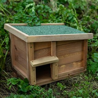 A wooden hedgehog hibernation house available to buy from Amazon