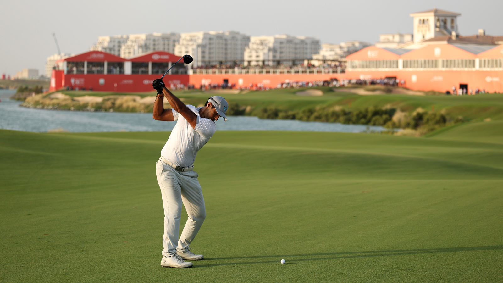 Aaron Rai hits a shot on the 18th hole at Yas Links
