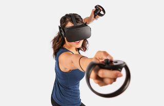 woman wielding oculus rift headset and touch controllers
