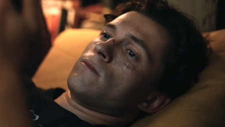Tom Holland as Peter Parker laying down in bed looking at his phone in Spider-Man: Brand New Day