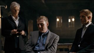 Judi Dench, Jesper Christensen, and Daniel Craig in the middle of an interrogation in Quantum of Solace.
