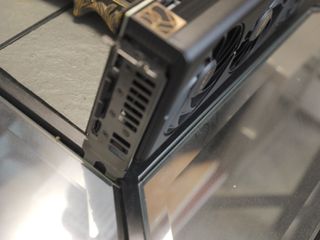 An ASUS ProArt RTX 4060 Ti graphics card sitting on a desk