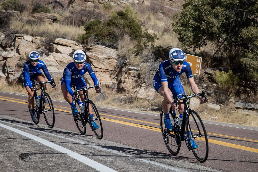 Riders sail through one of the fast corners on a descent
