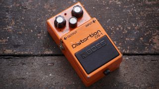 Boss DS-1 distortion pedal on a wooden floor