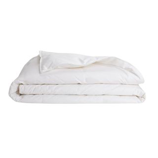 A white Brooklinen Down Comforter, folded