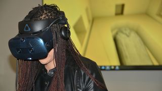 A VR headset provides Jessica Johnson, a doctoral candidate in Egyptology at UC Berkeley, with a tour of a 2,500-year-old Egyptian tomb.