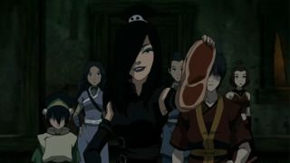June holding up meat with Team Avatar behind her.