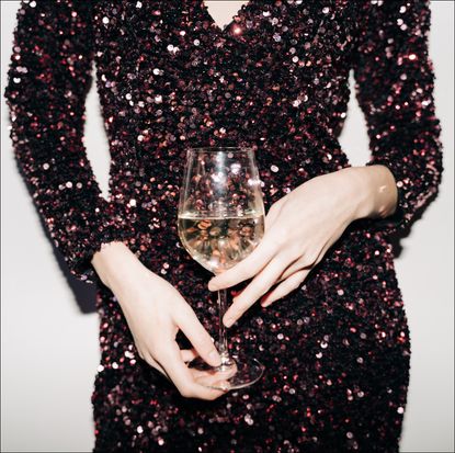 Close up of woman hands with champagne glass