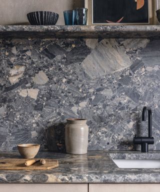Close up of gray marble splashback and countertop