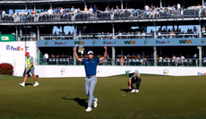 AJ Ewart celebrates to the crowd after holing a putt