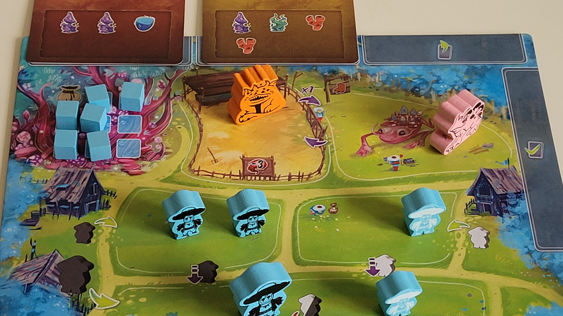 Wooden meeples scattered across the Arborea board