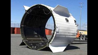 The Dragon’s trunk surprisingly landed in the water in tact after being jettisoned during the launch abort test.