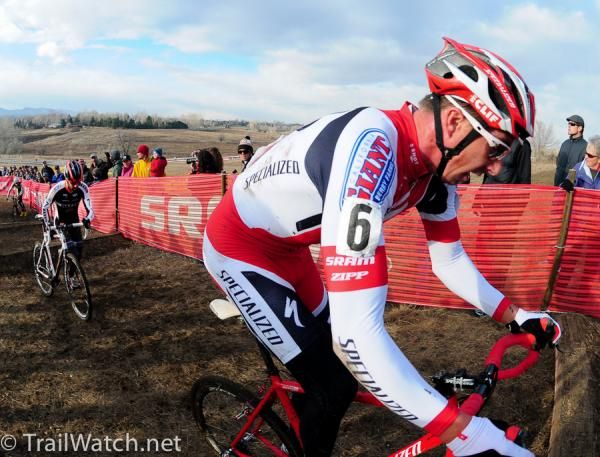 Todd Wells (Specialized) riding the railroad ties while Kabush runs them.