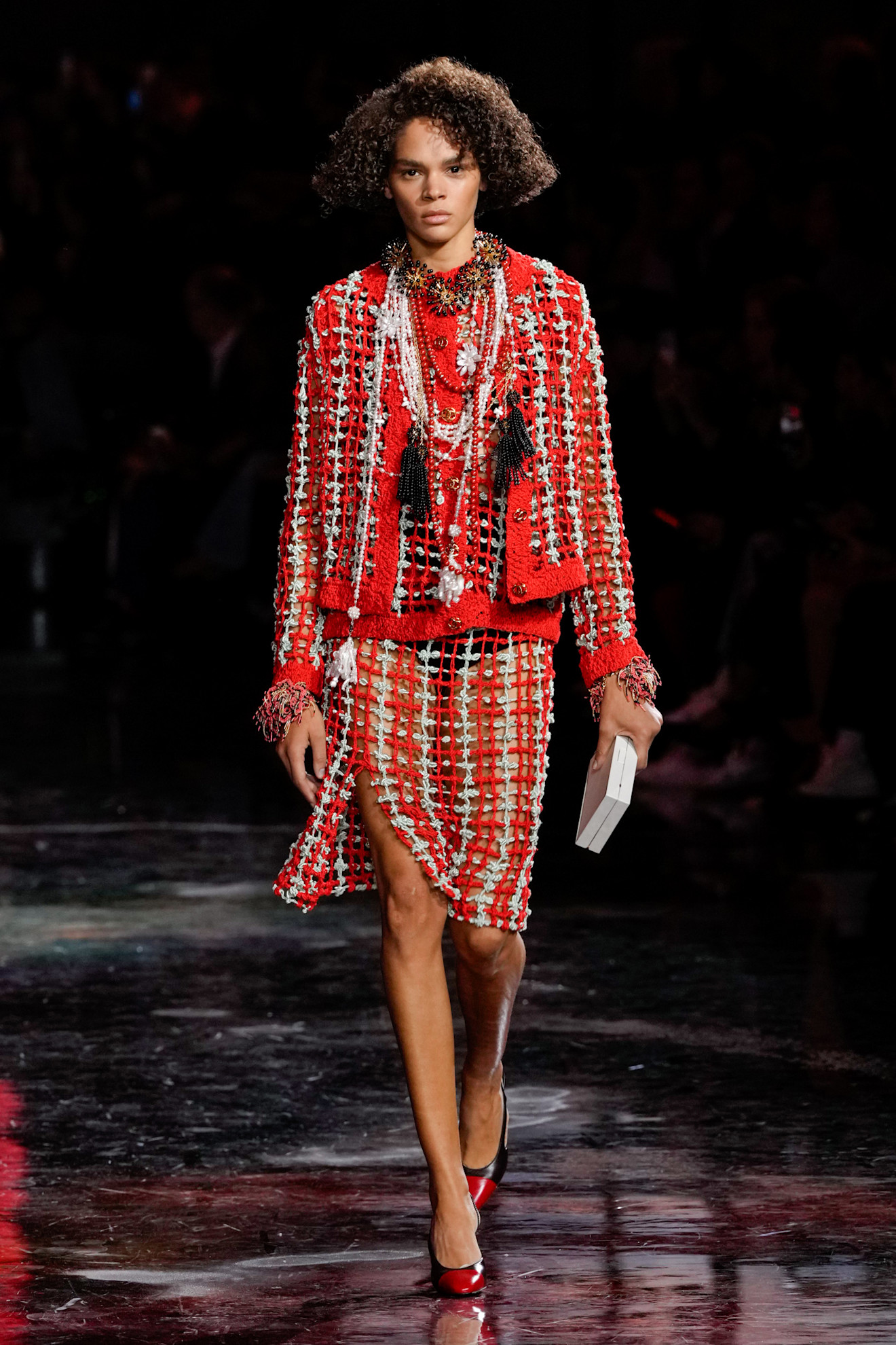 a model wearing Chanel plaid on the runway
