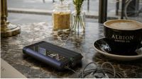 iFi iDSD GR 2 DAC / headphone amplifier on a table next to a coffee mug