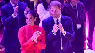 Meghan, Duchess of Sussex and Prince Harry, Duke of Sussex clapping during the Opening Ceremony of the One Young World Summit 2022