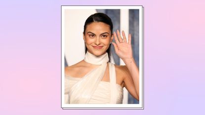  Camila Mendes wears a white dress and waves as she attends the 2023 Vanity Fair Oscar Party Hosted By Radhika Jones at Wallis Annenberg Center for the Performing Arts on March 12, 2023 in Beverly Hills, California./ in a pink and purple template