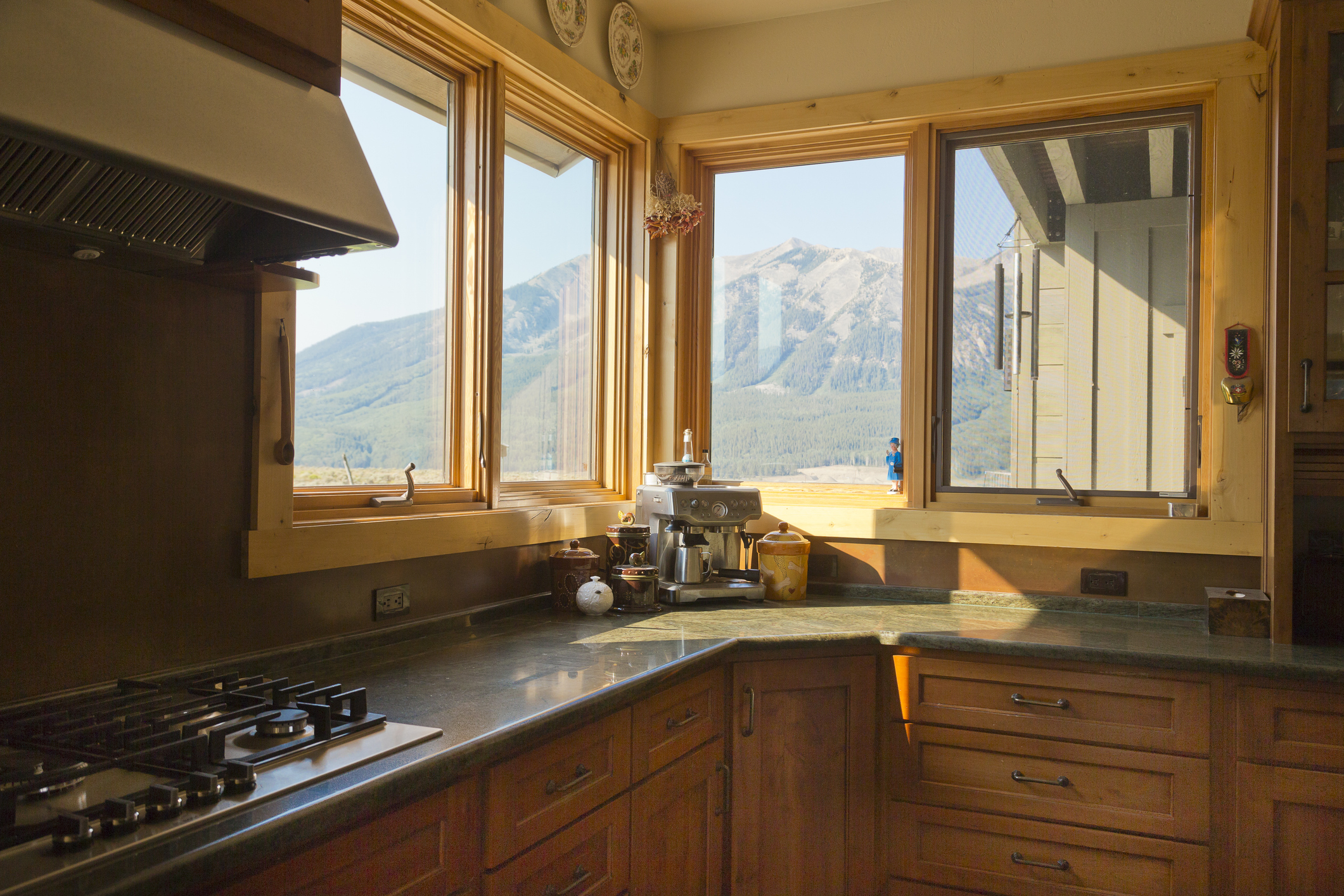 Private home in Crested Butte, Colorado. The kitchen has a corner devoted to windows with a mountain view.