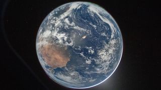 Planet Earth photographed from the Artemis II space craft window