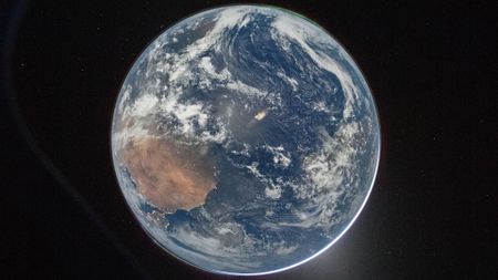 Planet Earth photographed from the Artemis II space craft window
