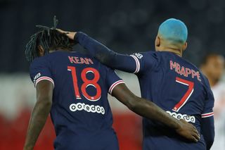 Kylian Mbappe (right) celebrates with Paris St-Germain team-mate Moise Kean