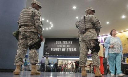 U.S. Army men stand guard at Penn Station in New York City