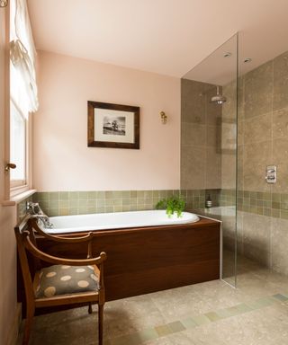 bathroom with green tiles and pale pink walls