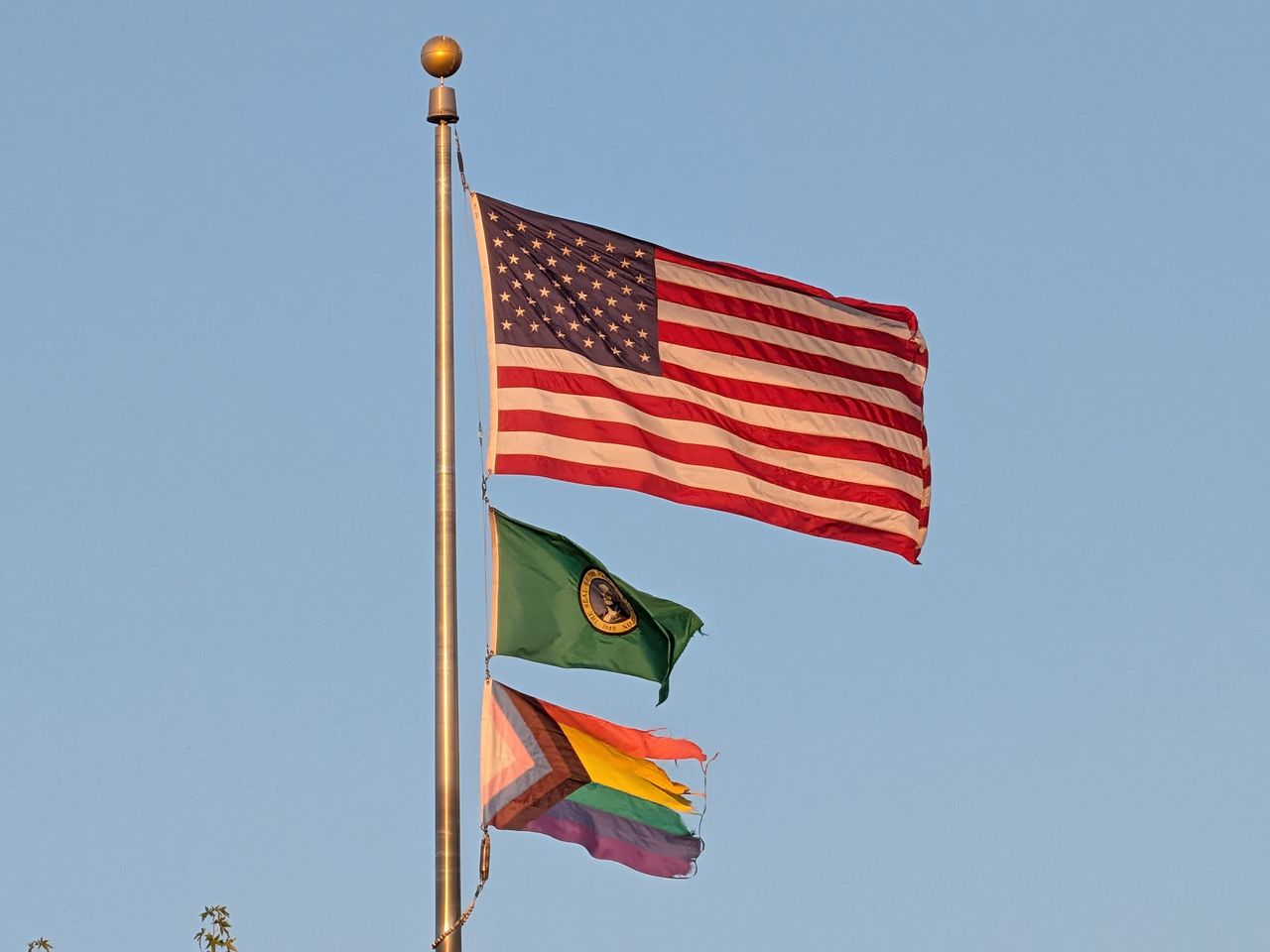 Three flags on a pole