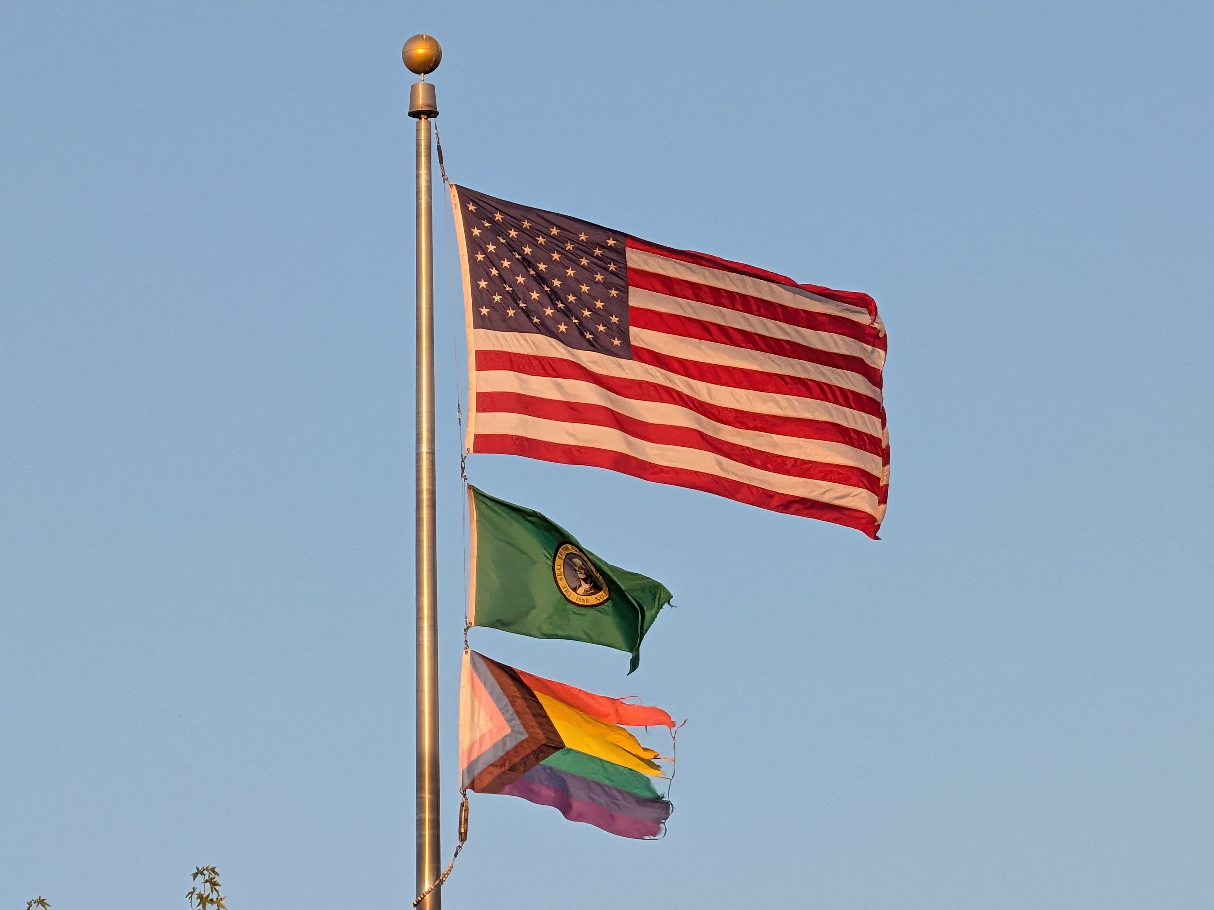 Three flags on a pole