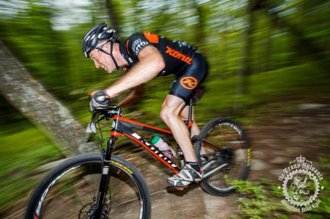 Kris Sneddon blasts through a rock section on the enduro stage descent
