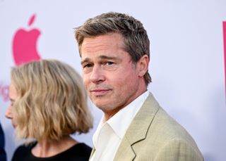 Brad Pitt looks at a camera