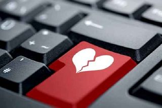 Keyboard with a picture of a broken heart on it
