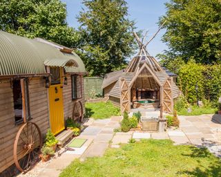 small wooden building with hot tub